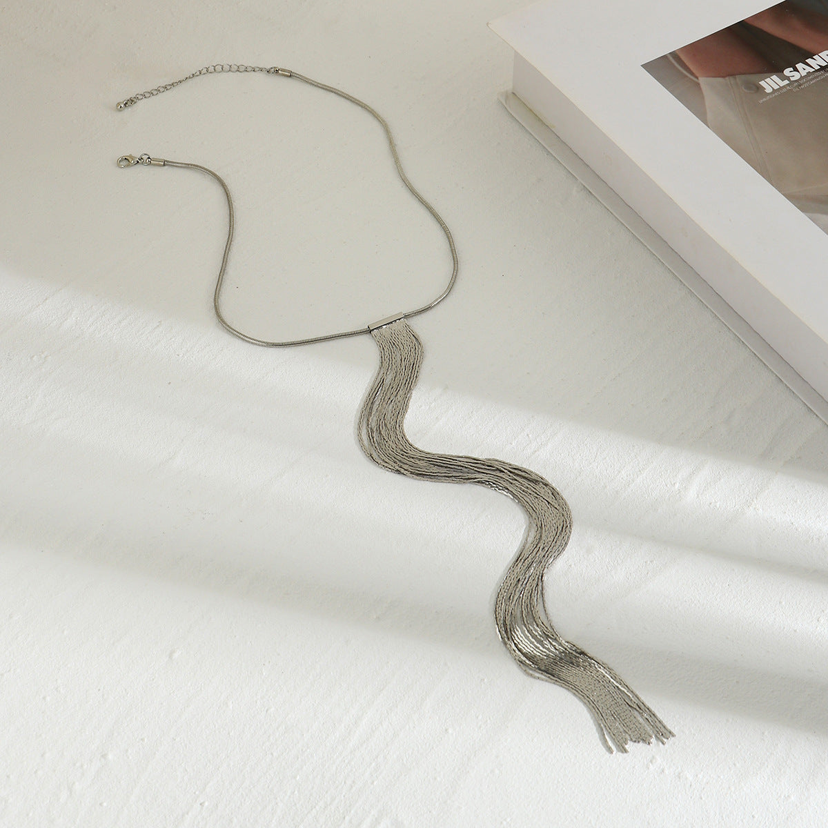Spicate snake bone chain neck chain with a cool and stylish design, featuring a textured chain and tassel necklace